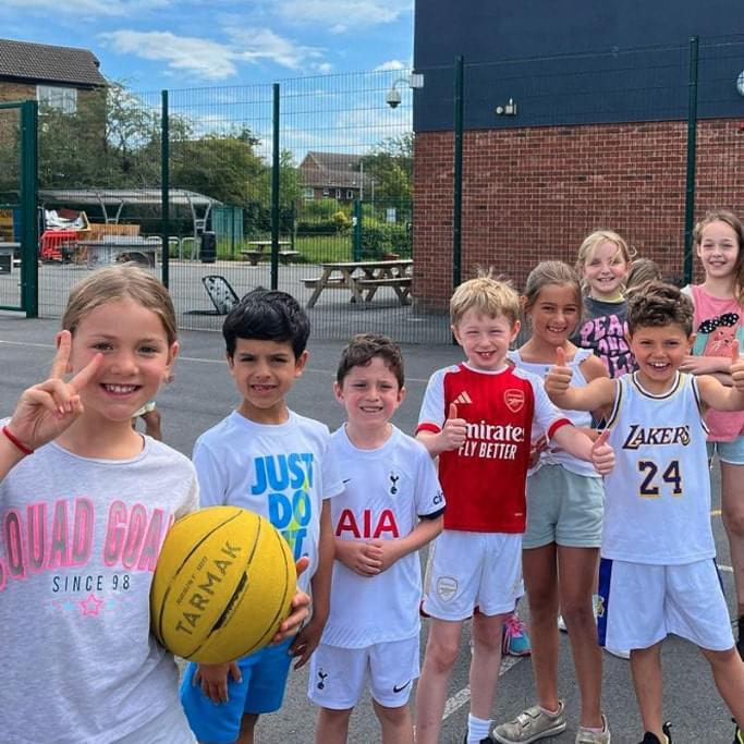 Young kids posing for a picture after summer holiday camp in London