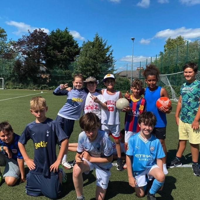 Young boys posing after Rising stars football club in london