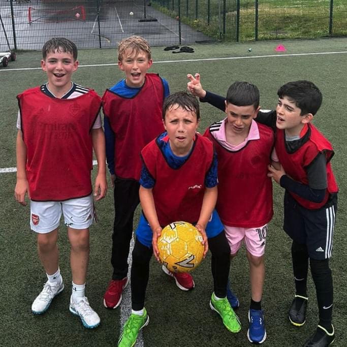 Four young boys after football practice in london