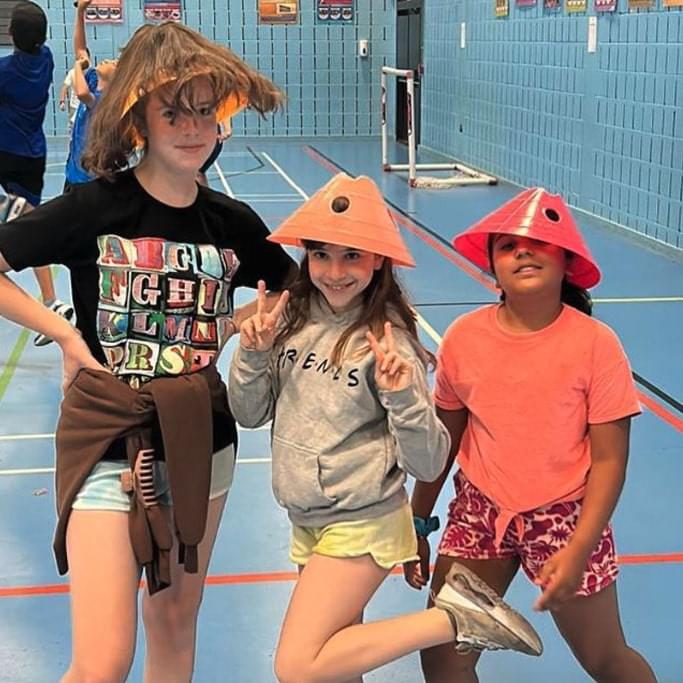 Three young gils posing at a Rising Stars birthday party