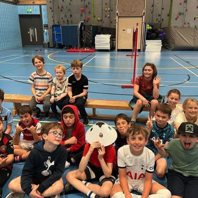 Bunch of kids posing for a group photo at a Rising Stars holiday camp in London
